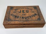 an old wooden box with a sign that says jeu de construction on it