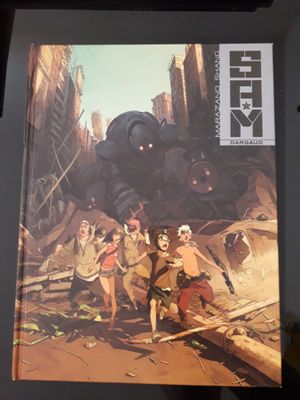 une image représentant un livre sur lequel figure un groupe de personnes debout devant un robot géant