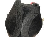 a black hat that has a red ribbon on it