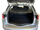 the back of a silver car with its trunk open on a white background