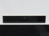 two black and white televisions sitting next to each other on a table