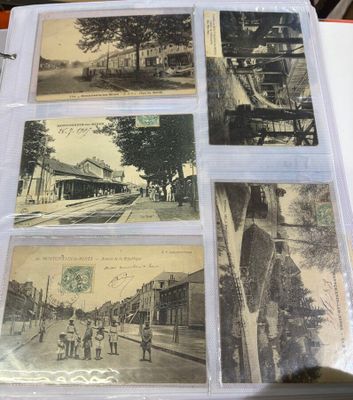 four old postcards on a table with a picture of a train