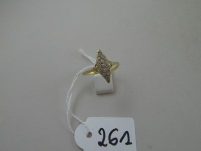 a gold ring with a diamond star on top of it