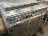 an image of a kitchen with a large grill in the middle of it