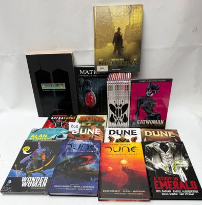 a lot of books that are sitting on a table