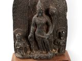 statue of a woman with a dog and a cat on a wooden base
