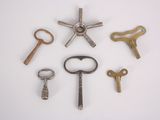 many different types of keys on a white surface