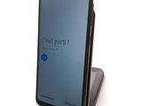 the back of a black phone with the text cost part on it