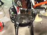 a chair that is sitting in the middle of a pile of junk