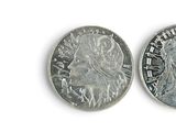 a silver coin with a picture of a woman on it