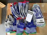 many pairs of gloves in a box on the floor