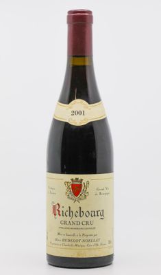 a bottle of wine that is sitting on a table