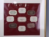 a picture of a framed picture of wine labels