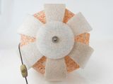a white and orange object on a white surface