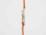 a close up of a cell phone with a cord attached to it