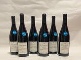 six bottles of wine are lined up in a row on a white background