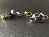 a group of rings sitting on top of a table next to each other
