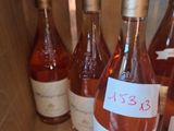 several bottles of wine are lined up in a wooden box