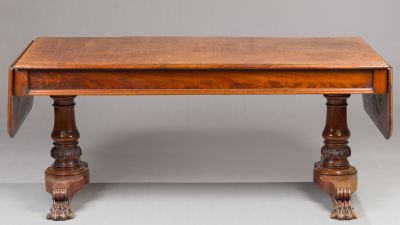 an image of a wooden table with two legs and a table top with a drop leaf