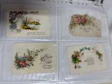 four small cards in a clear box on a table
