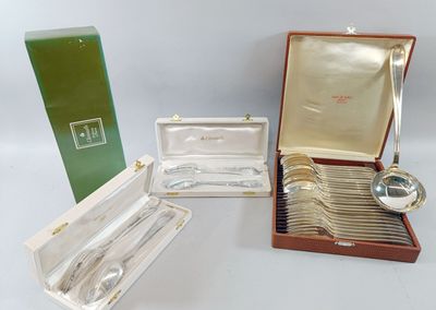 three silverplated spoons and a silverware set in a case