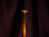 an old wooden baseball bat sitting on top of a wooden table