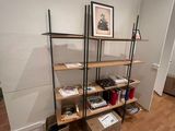 a room with a wooden floor and a bookshelf