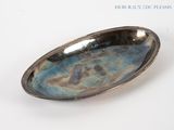 an image of a silver plate with a blue patt on it