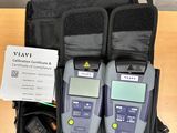 two electronic devices in a bag on a table