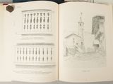 an open book with drawings of a building and a clock tower