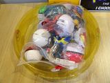 a yellow bowl filled with assorted items on a table