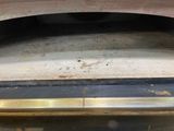 a close up of an oven with a lot of rust on it