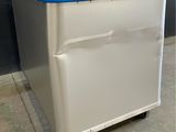 a white box with a blue lid sitting on top of it