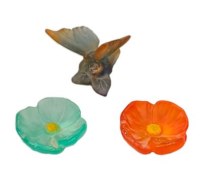 three different colored flowers and a bird on a white background