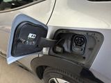 an electric car is being charged at a charging station