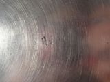 a close up view of a metal pan with holes in it