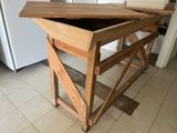 a wooden table with a wooden top in a kitchen