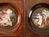 two framed pictures of a woman and a child in a wood frame