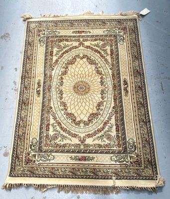 an antique persian rug with a medallion design on the center