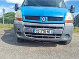 a blue van that is parked on the side of the road