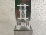 a small glass device that is sitting on a table