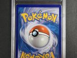 a close up of a pokemon card in a plastic case