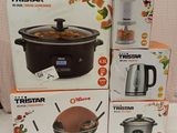 three boxes of different types of kitchen appliances sitting on a table