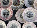 many plates with different designs on them on a table