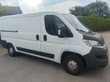 a picture of a white van parked in a parking lot
