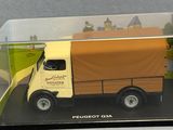 a toy truck in a clear box on a table