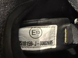 the label on the back of a motorcycle helmet is clearly visible