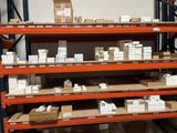 many boxes and packages on the shelves in the warehouse