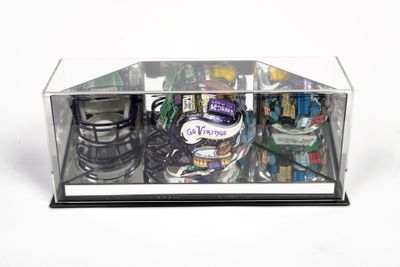 a glass display case with a variety of items inside of it