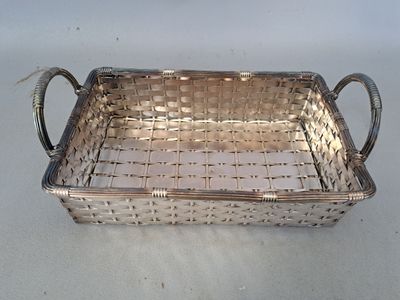 a silver tray with a handle on a table
